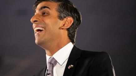 CARDIFF, WALES - AUGUST 03: Former Chancellor to the Exchequer Rishi Sunak laughs during a Conservative party membership hustings at the All Nations Centre on August 3, 2022 in Cardiff, Wales. Rishi Sunak and Liz Truss are holding hustings aroun...