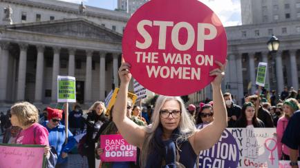 NEW YORK, NY - OCTOBER 08: Protesters gather during a rally for women's rights in Foley Square on October 8, 2022 in New York City. The demonstration, organized by the Women's March, is one of several taking place nationally on Saturday. The gro...