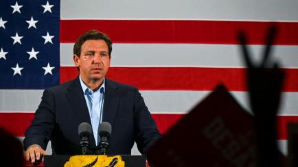 Florida Governor Ron DeSantis speaks during a "Unite and Win" event as he campaigns for re-electionon the eve of the US midterm elections, at Hialeah Park Clubhouse, in Hialeah, Florida, on November 7, 2022. (Photo by Eva Marie UZCATEGUI / AFP) ...