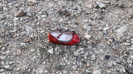 TOPSHOT - A child's shoe is pictured on January 8, 2020 at the scene of a Ukrainian airliner that crashed shortly after take-off near Imam Khomeini airport in the Iranian capital Tehran. - Search-and-rescue teams were combing through the smoking...