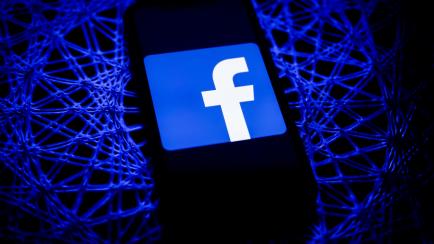Facebook logo displayed on iPhone screen is seen in this illustration photo taken in Poland on February 8, 2021. Facebook reacted negatively to Apple's privacy policy changes. (Photo illustration by Jakub Porzycki/NurPhoto via Getty Images)