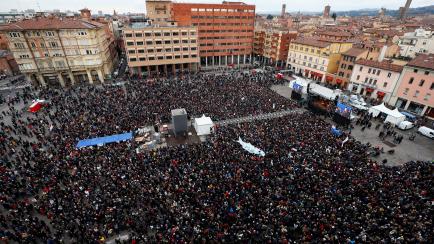 Supporters of "the sardines", a grassroots movement against far-right League leader Matteo Salvini, attend a demonstration in Bologna, Italy, January 19, 2020. REUTERS/Guglielmo Mangiapane