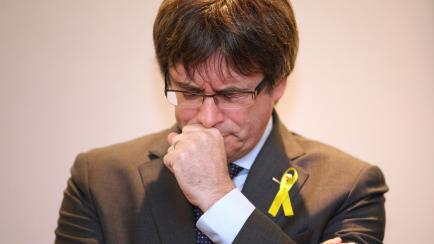 Ousted Catalan leader Carles Puigdemont pauses before speaking during a media conference in Brussels on Wednesday, Dec. 6, 2017. Catalan secessionist leader Carles Puigdemont and four close allies addressed the decision by Spain to drop a Europe...