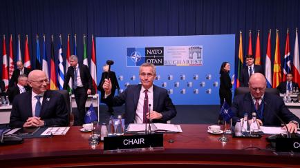 NATO Secretary General Jens Stoltenberg (C) opens a meeting of the North Atlantic Council (NAC) in Foreign Ministers Session during the meeting of the NATO Ministers of Foreign Affairs in Bucharest, Romania, on November 30, 2022. - The meeting i...