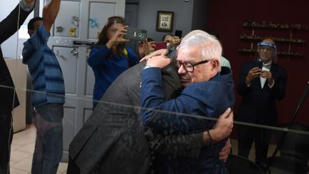Gay equality activist Marco Castillo, right, embraces his longtime partner Rodrigo Campos, after they were married before a judge, in San Jose, Costa Rica, Tuesday, May 26, 2020. Costa Rica became the latest country to legalize same-sex marriage...