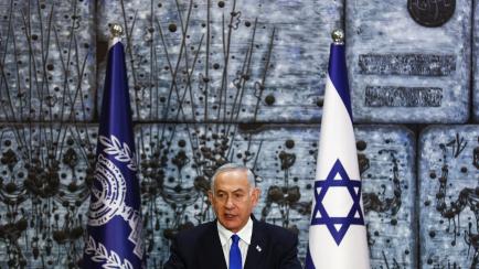 Benjamin Netanyahu speaks during a ceremony where Israel President Isaac Herzog handed him the mandate to form a new government following the victory of the former premier's right-wing alliance in this month's election at the President's residen...