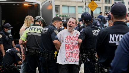 TOPSHOT - NYPD officers arrest protestors during a "Black Lives Matter" demonstration on May 28, 2020 in New York City, in outrage over the death of a black man in Minnesota who died after a white policeman kneeled on his neck for several minute...