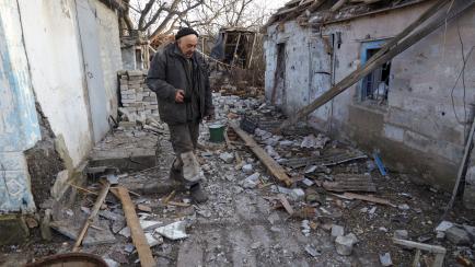 Donetsk (Ukraine), 20/02/2022.- Local resident Valery walks around a damaged homestead as a result of shelling in Tamarchuk village near Marinka not far from pro-Russian militants controlled city of Donetsk, Ukraine, 20 February 2022. Tamarchuk ...