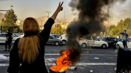 FILE - In this photo taken by an individual not employed by the Associated Press and obtained by the AP outside Iran, Iranians protests the death of 22-year-old Mahsa Amini after she was detained by the morality police, in Tehran, Oct. 1, 2022. ...