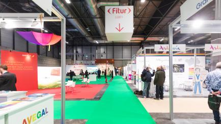 MADRID, SPAIN - JANUARY 22: People walk through the space of LGTB+ through the FITUR Tourism Fair opening at Ifema on January 22, 2022 in Madrid, Spain. Fitur 2022 welcomes in its 42nd edition 6,933 companies from 107 countries. Compared to last year, with the number of companies reduced to 5,000, the number of participants increased by 39.7%. In addition, it almost doubles the States and international representatives who attended the fair in person in 2021 (Photo by David Benito/Getty Images)