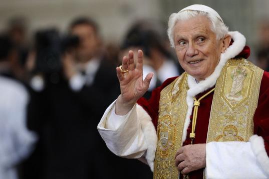 Pope Benedict XVI waves to faithful during his annual prayer at the Immaculate Conception statue at Piazza di Spagna (Spanish Steps) in Rome on December 8, 2011 on the day dedicated to virgin Mary. Pope Benedict reflected earlier in the day Sole...