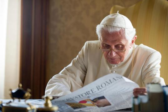 FILE - In this July 23, 2010 file photo made available by the Vatican newspaper L'Osservatore Romano, Pope Benedict XVI reads the L'Osservatore Romano newspaper in the pontiffs' summer residence in Castel Gandolfo, in the hills overlooking Rome....
