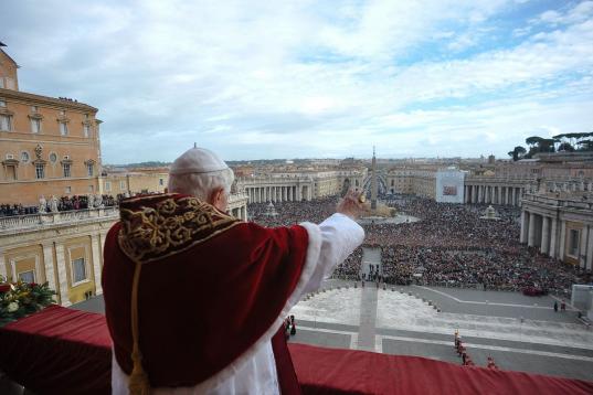 Pope Benedict XVI delivers the 'urbi et orbi' (to the city and the world) blessing from the balcony of the St Peter' s basilica at Vatican on December 25, 2009. The pontiff urged wealthy nations on Friday to show 'acceptance and welcome' to mig...