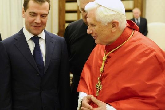 Pope Benedict XVI (R) exchanges presents with Russian President Dmitry Medvedev during an audience at The Vatican on December 3, 2009. Russia and the Vatican have established full diplomatic relations ending longstanding tensions, the Kremlin an...