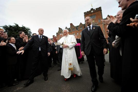 BIRMINGHAM, ENGLAND - SEPTEMBER 19:  Pope Benedict XVI shakes hands as he leaves Oscott College, the home of the Seminary of the Archdiocese of Birmingham, where he met with the Bishops of England, Scotland and Wales, on September 19, 2010 in Bi...