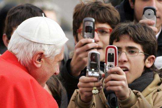 Vatican City, VATICAN CITY STATE:  Pope Benedict XVI greets pilgrims on St Peter's square at the Vatican during his weekly general audience, 28 December 2005. The pontiff prayed for the victims of last year's Asian earthquake and tsunami, which ...