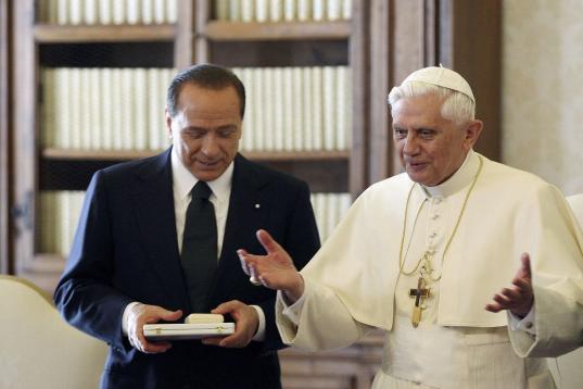 VATICAN CITY - NOVEMBER 19: Pope Benedict XVI (R) talks with Italian Prime Minister Sivio Berlusconi during their  meeting November 19, 2005 in Vatican City. This is the first meeting between the two since teh Pope's election.  (Photo by Alberto...