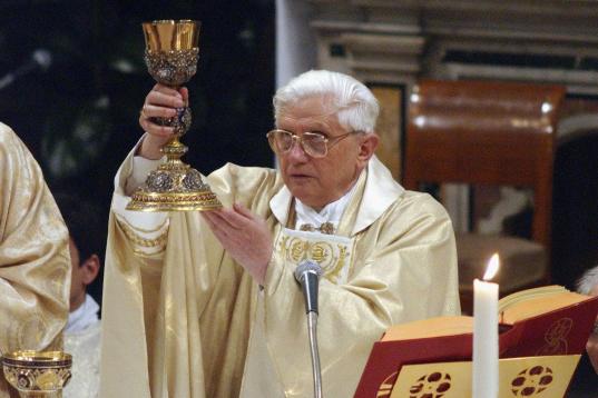VATICAN CITY - APRIL 20:  Newly elected Pope Benedict XVI, Cardinal Joseph Ratzinger of Germany, leads his first mass with all the cardinals in the Sistine Chapel on April 20, 2005 in the Vatican. Pope Benedict announced his first job would be t...