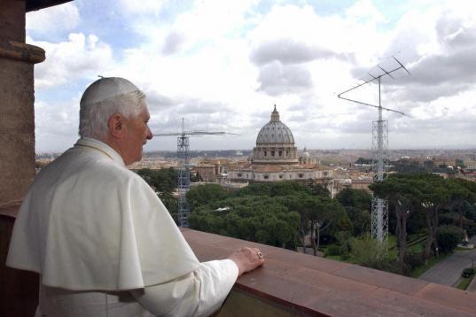 VATICAN CITY, Vatican:  Pope Benedict XVI stands on the balcony and looks outside 20 April 2005 in the Vatican City. Newly elected Pope Benedict XVI made his first trip outside the Vatican, to his former apartment in Rome where he was greeted by...