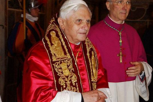 VATICAN CITY, VATICAN - APRIL 19:  Newly elected Pope Joseph Ratzinger (L) as Benedetto XVI leaves the Sistine Chapel to appear on the central balcony of St Peter's Basilica  April 19, 2005 in Vatican City. The 265th Pope will lead the world's 1...