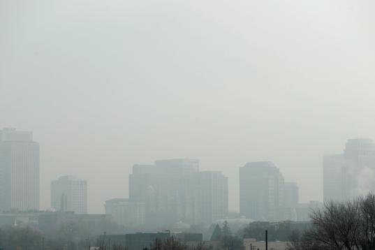 Tall buildings are shrouded in smog in downtown Salt Lake City, Utah, U.S. December 12, 2017. Sometimes during the winter, temperature inversions form in Salt Lake Valley, when the upper air temperature is warmer than the air on the valley floor...