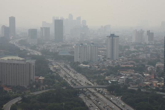 A general view of buildings as smog covers the capital city of Jakarta, Indonesia, July 29, 2019 in this photo taken by Antara Foto. Picture taken July 29, 2019  Antara Foto/Indrianto Eko Suwarso/ via REUTERS ATTENTION EDITORS - THIS IMAGE WAS P...