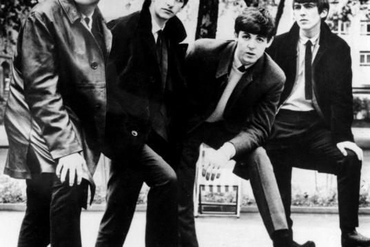 FILE - In this undated file photograph British pop band The Beatles, John Lennon (left) Ringo Starr, Paul McCartney and George Harrison (right) pose for a photograph. Apple Inc. said Tuesday, Nov. 16, 2010, its iTunes service will sell music fro...