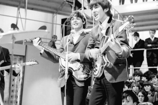 The Beatles - left to right Paul McCartney, George Harrison and Paul McCartney at Rediffusion's Wembley Studio rehearsing for 'Around the Beatles', the first British television show built around the group.
