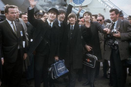 FILE - In this Feb. 7, 1964 file photo, the Beatles arrive in New York for their first U.S. appearances. From left are: John Lennon, Paul McCartney, Ringo Starr and George Harrison. McCartney turned 70 Monday June 18, 2012. (AP Photo/File)