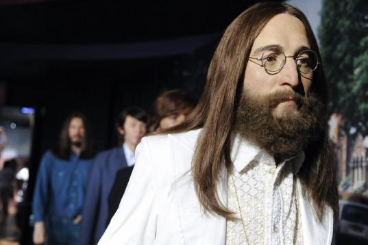 A wax figure representing The Beatles' John Lennon is unveiled at Madame Tussauds New York, Thursday June 14, 2012, in New York. (Photo by Evan Agostini/Invision/AP)