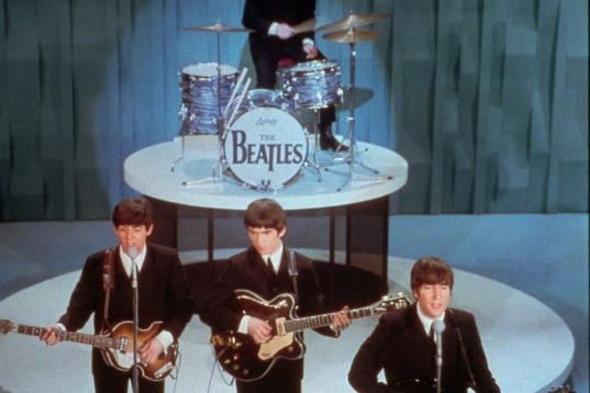FILE - The Beatles perform at the "Ed Sullivan Show," in New York in this Feb. 9, 1964 file photo. Universal Music Group can buy the famed British music company EMI, including the hugely lucrative Beatles catalogue, the European Union's competit...