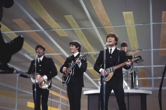 The Beatles, performing on the Ed Sullivan Show, New York City, 9th February 1964. Left to right: Paul McCartney, George Harrison (1943 - 2001), John Lennon (1940 - 1980) and Ringo Starr. (Photo by Paul Popper/Popperfoto/Getty Images)