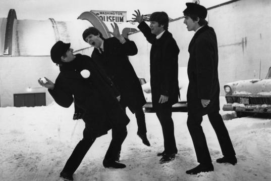 13th February 1964:  The Beatles soon after their arrival in Washington, USA, playing in the snow outside the Coliseum where they were scheduled to perform before a sell-out audience.  (Photo by Central Press/Getty Images)