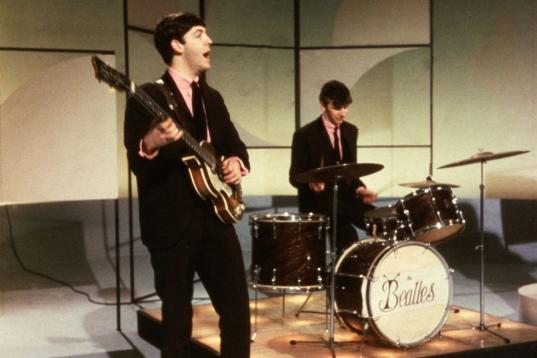 1963:  Paul McCartney and Ringo Starr of The Beatles performing during an early television performance on 'Thank Your Lucky Stars' on February 17th 1963.  (Photo by Hulton Archive/Getty Images)