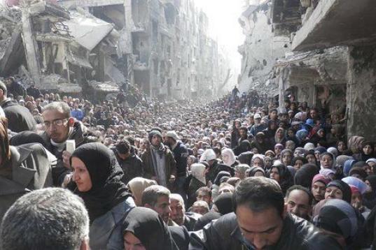 La Agencia de Naciones Unidas para los Refugiados Palestinos difundió en marzo de 2014 esta foto del campo de Yarmouk, en Damasco, donde más de 18.000 personas siguen hoy atrapadas entre el fuego cruzado del régimen y de los grupos rebeldes -...