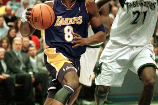Los Angeles Lakers' Kobe Bryant drives past Minnesota Timberwolves' Kevin Garnett in the first quarter 17 December 1999 at the Target Center in Minneapolis, Minnesota. The Lakers won 97-88. AFP PHOTO/CRAIG LASSIG (Photo by CRAIG LASSIG / AFP) (P...