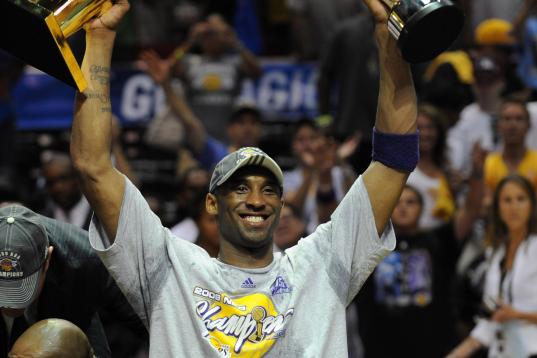 Kobe Bryant of the Los Angeles Lakers celebrates victory following Game 5 of the NBA Finals against the Orlando Magic at Amway Arena on June 14, 2009 in Orlando, Florida. The Lakers won the National Basketball Association championships defeating...
