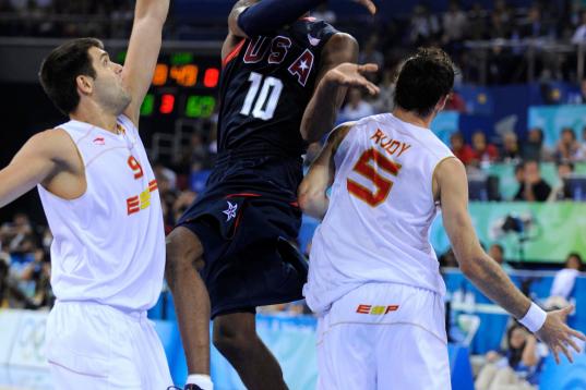 (HR) ABOVE: Kobe Bryant gets a pass around Spain's Felipe Reyes #9 and Rudy Fernandez, #5. The U.S. men's basketball team won the gold medal at the Beijing 2008 Olympic Games with a 118-107 victory over Spain Sunday afternoon at the Olympic Bask...