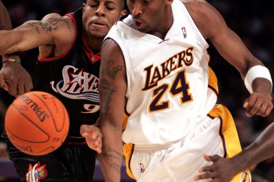 Lakers' Kobe Bryant drives past 76ers' defender Andre Iguodala in the fourth quarter of play during the Lakers' 10494 win Sunday, December 31, 2006 at Staples Center.  (Photo by Myung J. Chun/Los Angeles Times via Getty Images)