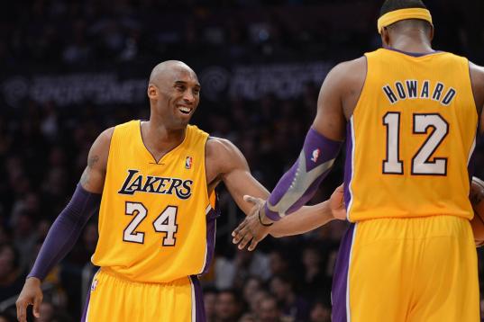 LOS ANGELES, CA - DECEMBER 28:  Kobe Bryant #24 of the Los Angeles Lakers jokes with Dwight Howard #12 during the game against the Portland Trail Blazers at Staples Center on December 28, 2012 in Los Angeles, California.  The Lakers won 104-87. ...
