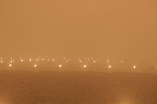 A view of the runway during a sandstorm blown over from North Africa known as "calima" at Las Palmas Airport
