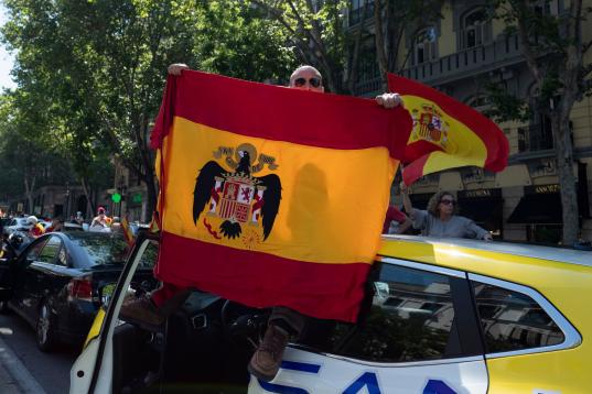 People holding Spanish flags take part on an in-vehicle protest against the Spanish government by Covid-19on May 23, 2020 in Madrid, Spain. Far right wing VOX party has called for in-vehicle protests across Spain against the Spanish government's...
