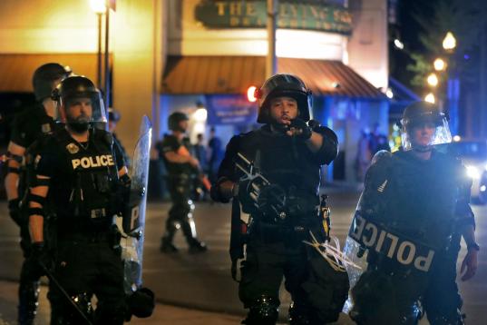 A police officer  shouts to members of the media while trying to clear the streets of demonstrators in Memphis, Tennessee, early Monday, June 1, 2020, protesting the death of George Floyd who died in Minneapolis police custody May 25, 2020.  (Da...