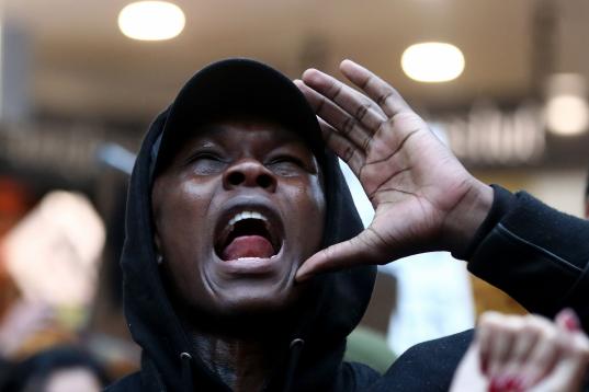 AUCKLAND, NEW ZEALAND - JUNE 01: UFC fighter Israel Adesanya joins in the protest down Queen Street on June 01, 2020 in Auckland, New Zealand. The rally was organised in solidarity with protests across the United States following the killing of ...