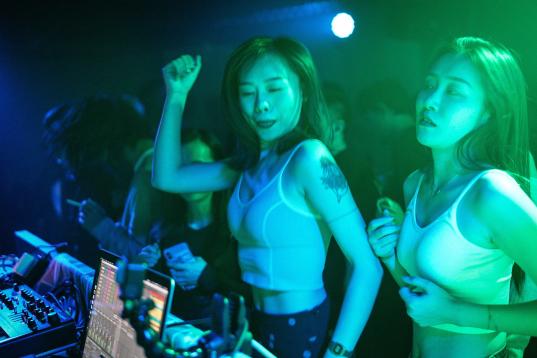 WUHAN, CHINA - SEPTEMBER 18:  (CHINA OUT) People dance inside the disco bar on September 18, 2020 in Wuhan, Hubei province, China. As there have been no recorded cases of community transmission in Wuhan since May, life for residents is returning...