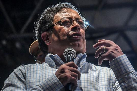Left-wing Colombian presidential candidate Gustavo Petro delivers a speech during a campaign rally in Medellin, Colombia, May 20, 2022. - Petro is leading in opinion polls for the upcoming presidential election on May 29. (Photo by JOAQUIN SARMI...
