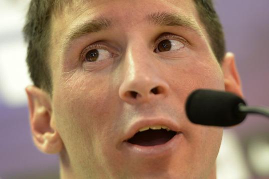 Barcelona's Argentinian forward Leo Messi gives a press conference after taking part to a training session at the Sports Center FC Barcelona Joan Gamper in Sant Joan Despi, near Barcelona, on July 17, 2013.   AFP PHOTO/ LLUIS GENE        (Photo ...