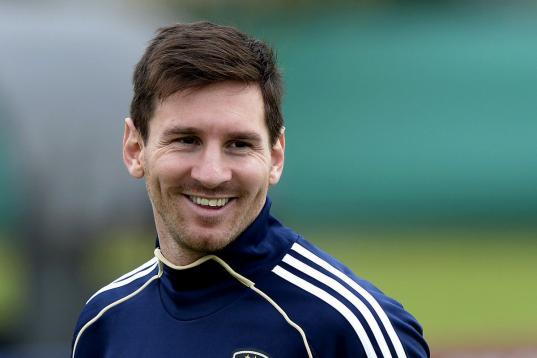 Argentina's forward Lionel Messi smiles during a training session in Ezeiza, Buenos Aires on March 19, 2013 ahead of the Brazil 2014 FIFA World Cup South American qualifier football match against Venezuela on March 22. AFP PHOTO / Juan Mabromata...