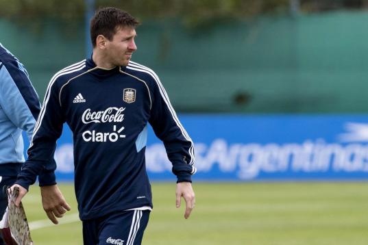Argentina's Lionel Messi leaves the field after a training session in Buenos Aires, Argentina, Tuesday, March 19, 2013. Argentina will face Venezuela in a 2014 World Cup qualifying soccer game in Buenos Aires on March 22. (AP Photo/Eduardo Di Baia)