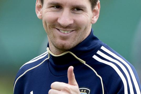 Argentina's forward Lionel Messi gives the thumb up during a training session in Ezeiza, Buenos Aires on March 19, 2013 ahead of the Brazil 2014 FIFA World Cup South American qualifier football match against Venezuela on March 22. AFP PHOTO / Ju...